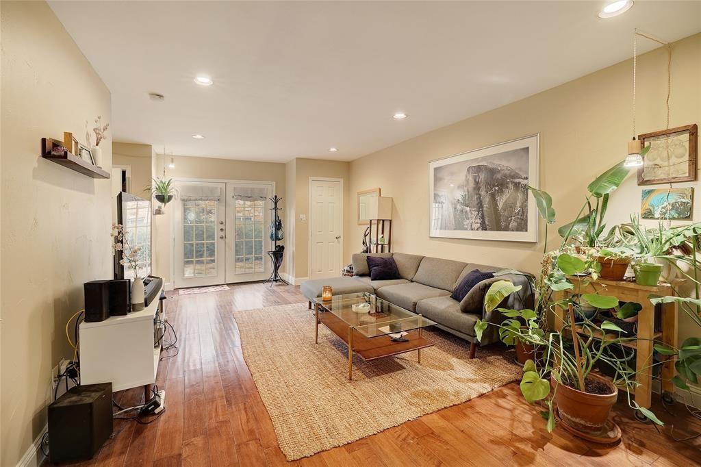 1911 Lightsey Road, Unit C Austin, TX 78704 - Photo 16 of 23 a living room with furniture and a wooden floor