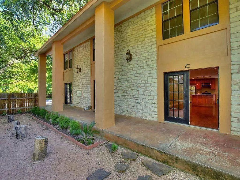 1911 Lightsey Road, Unit C Austin, TX 78704 - Photo 5 of 23 a front view of a house with a yard