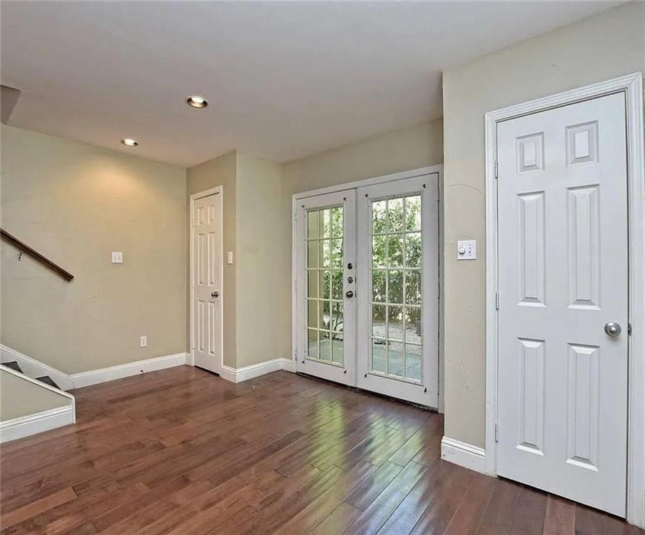 1911 Lightsey Road, Unit C Austin, TX 78704 - Photo 8 of 23 an empty room with wooden floor and windows
