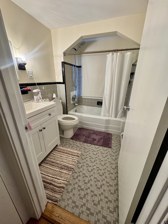 72 Redlands Road Boston, MA 02132 - Photo 14 of 31 a bathroom with a sink and a mirror