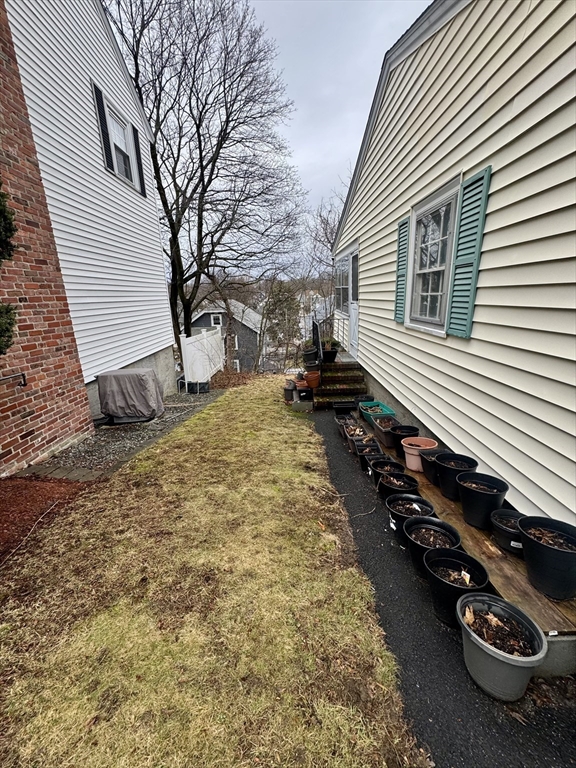 72 Redlands Road Boston, MA 02132 - Photo 24 of 31 a view of a backyard of the house