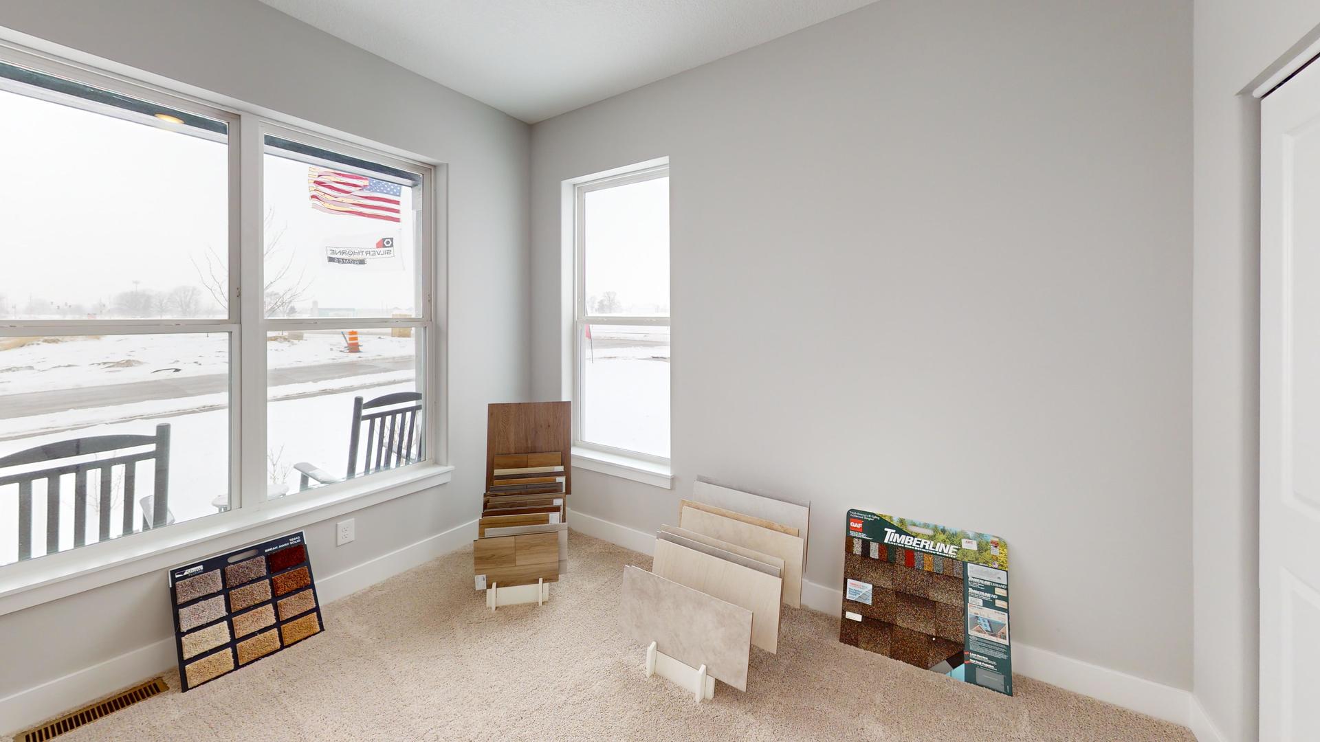 8-3 West Orchid Lane, Unit 3 Channahon, IL 60410 - Photo 17 of 28 a living room with furniture and a window