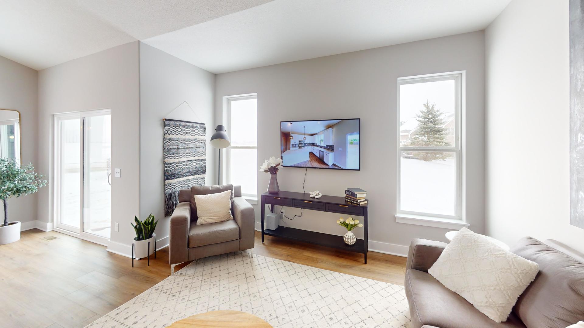 8-3 West Orchid Lane, Unit 3 Channahon, IL 60410 - Photo 23 of 28 a living room with furniture and a window