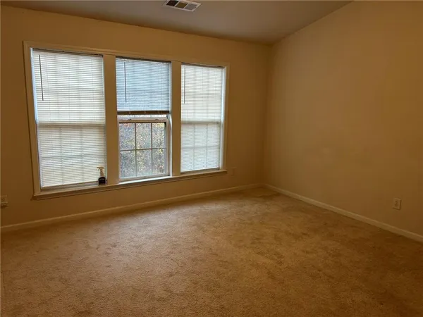 an empty room with a fireplace