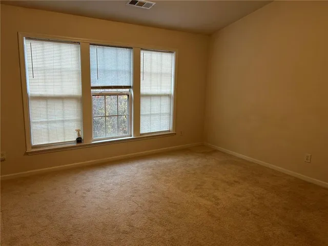 an empty room with a fireplace