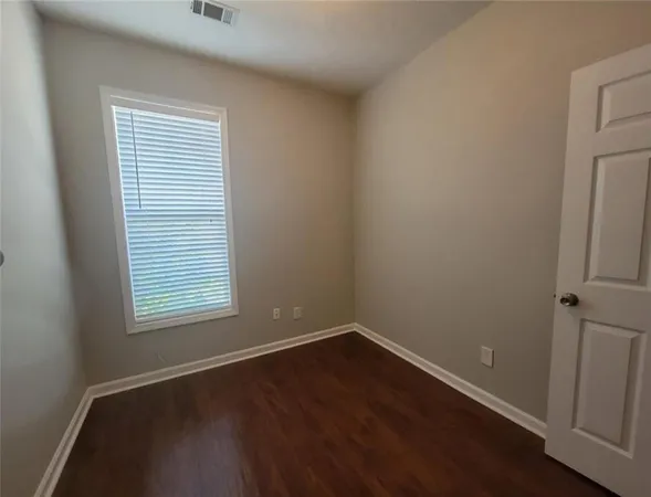 a view of a livingroom with a ceiling fan and window