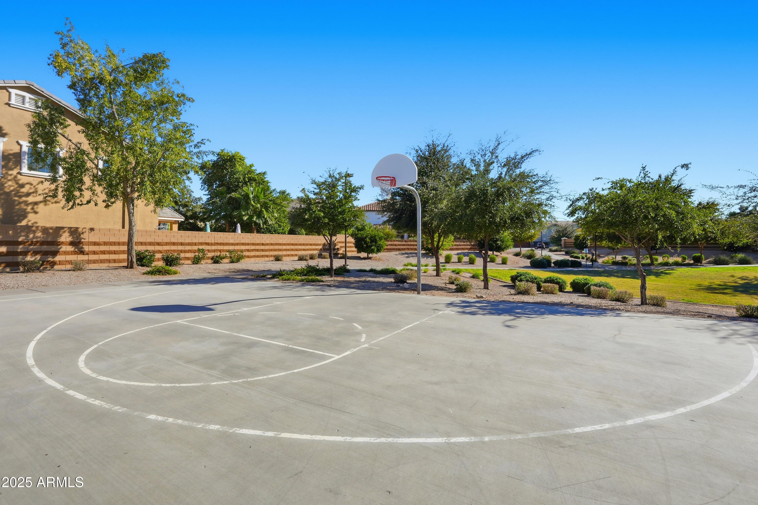 3343 East Russell Street Mesa, AZ 85213 - Photo 49 of 62 a view of a tennis ground with large trees