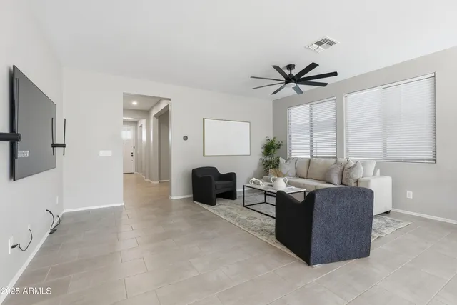 a living room with furniture fireplace and a flat screen tv