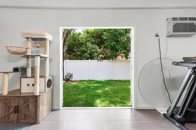 a view of a back yard from a room
