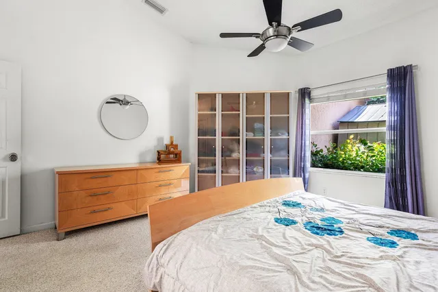 a bed room with a bed and a window