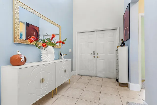 a bathroom with a sink mirror and vanity