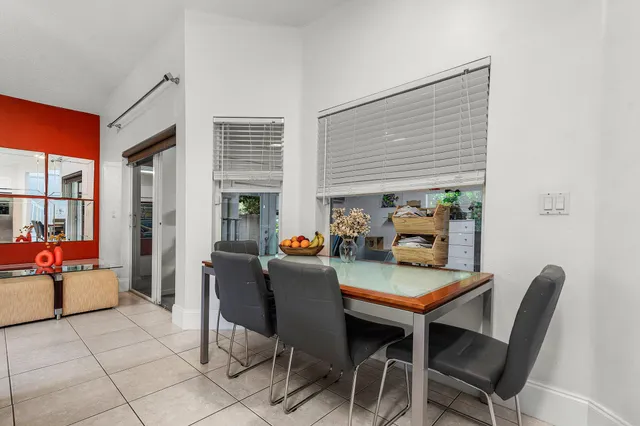 a dining room with furniture and window