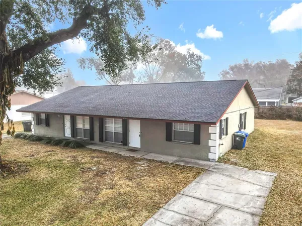 front view of a house with a yard