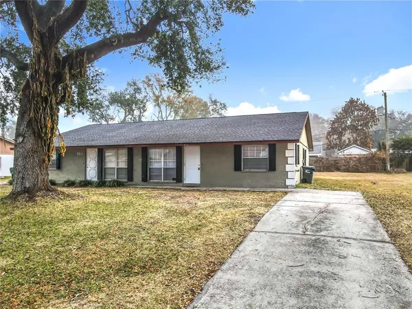 a front view of a house with yard