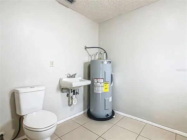a bathroom with a toilet and a sink