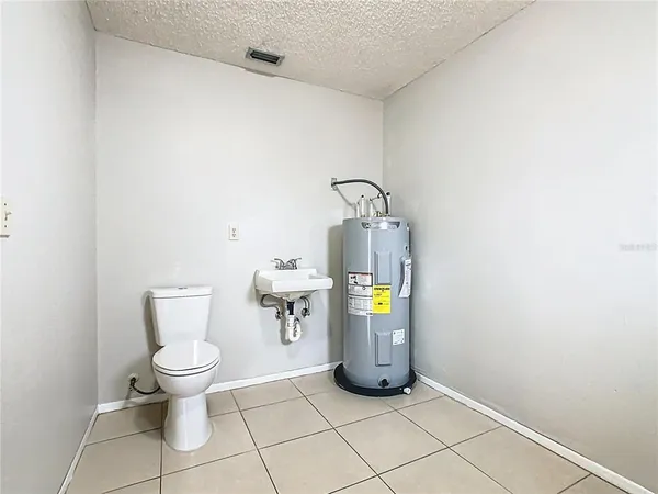 a view of a storage & utility room with window