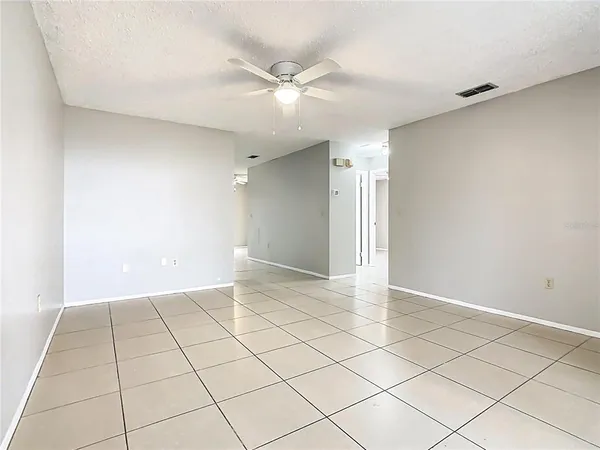 a view of an empty room and a window