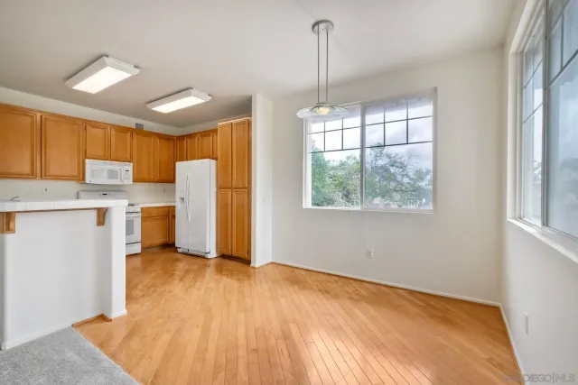 a kitchen with a stove a sink and a refrigerator