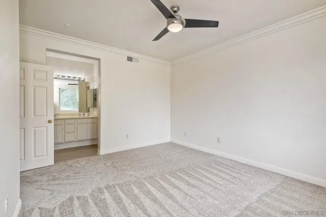 a bathroom with a double vanity sink toilet mirror and shower