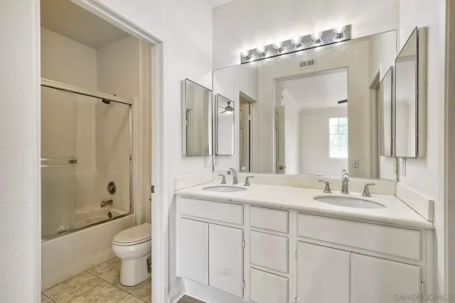 a bathroom with a shower and a toilet