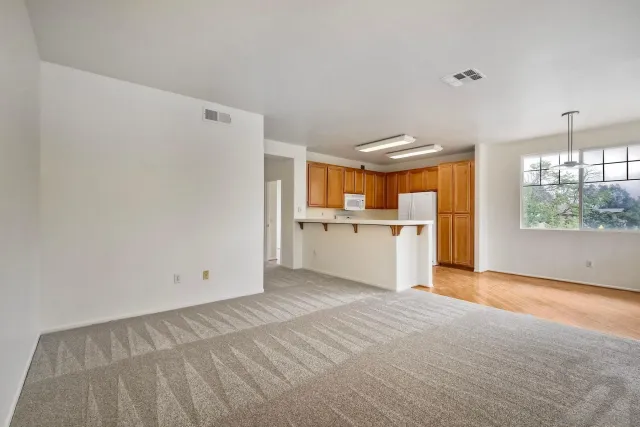 a view of a kitchen with a sink and a window