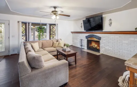 a living room with furniture and a fireplace