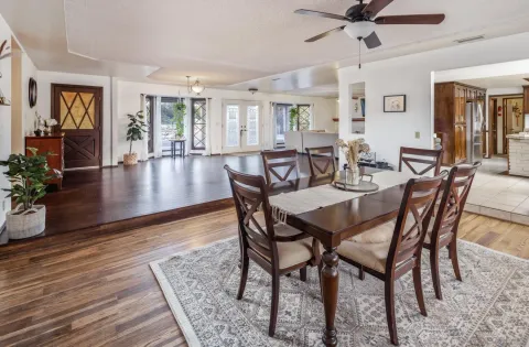 a view of a dining room with furniture window and wooden floor