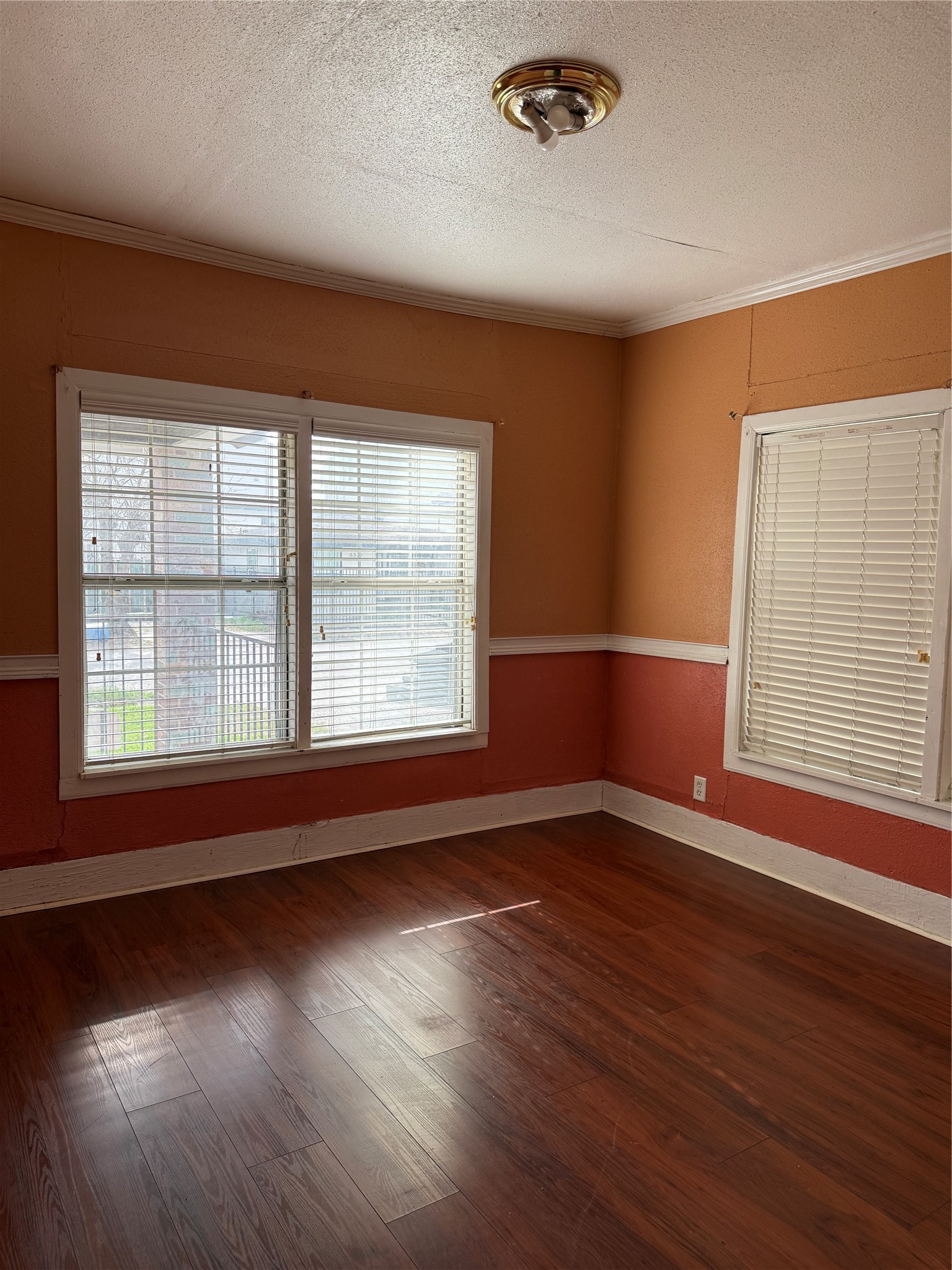 6318 Illinois Street Houston, TX 77021 - Photo 11 of 14 an empty room with wooden floor and windows