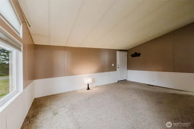 a view of an empty room with a fireplace