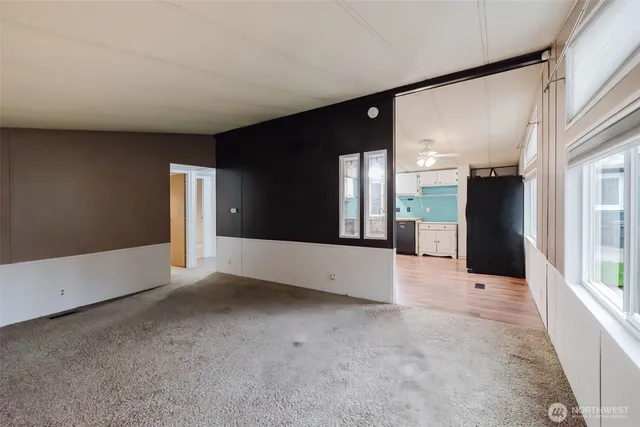 a kitchen with a refrigerator sink and cabinets