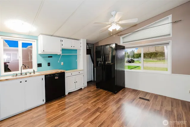 a view of a livingroom with wooden floor