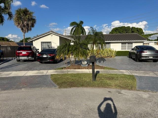 5531 Southwest 136th Court, Unit 1 Miami, FL 33175 - Photo 1 of 13 a view of a house with a garden and parking space
