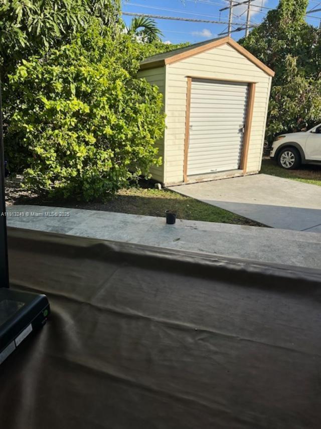 5531 Southwest 136th Court, Unit 1 Miami, FL 33175 - Photo 13 of 13 a view of a car park from a window