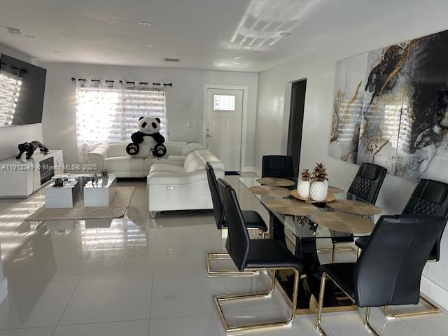 5531 Southwest 136th Court, Unit 1 Miami, FL 33175 - Photo 8 of 13 a living room with furniture and a large window