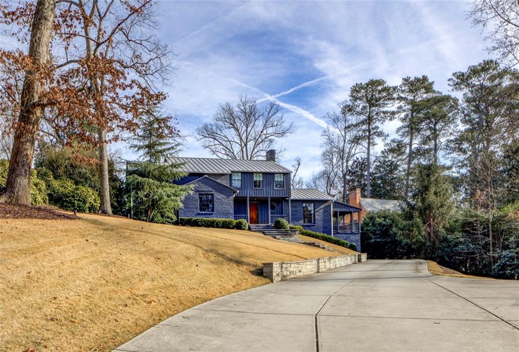 3195 Habersham Road Northwest Atlanta, GA 30305 - Photo 1 of 1 a view of a building with a swimming pool
