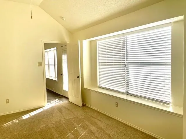 a view of a room with a large window