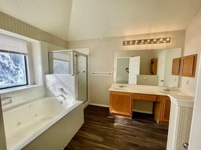 a view of bathroom with mirror and bathtub
