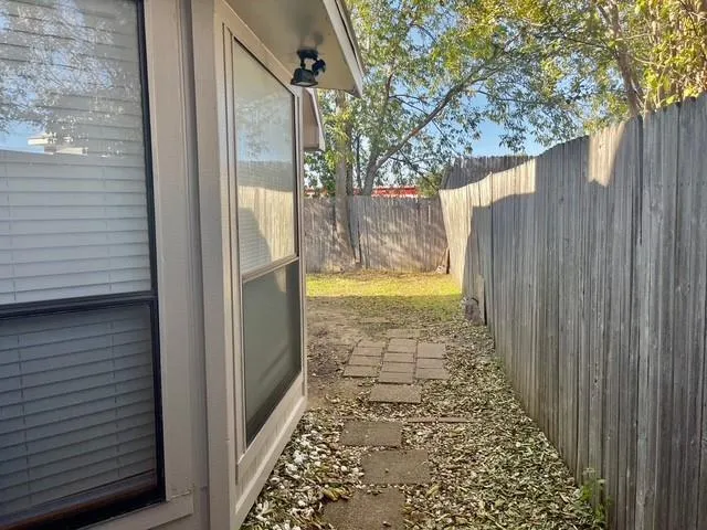 a view of a backyard of the house
