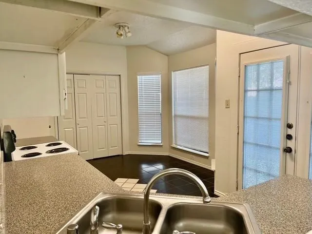 a bedroom with a bed and cabinets