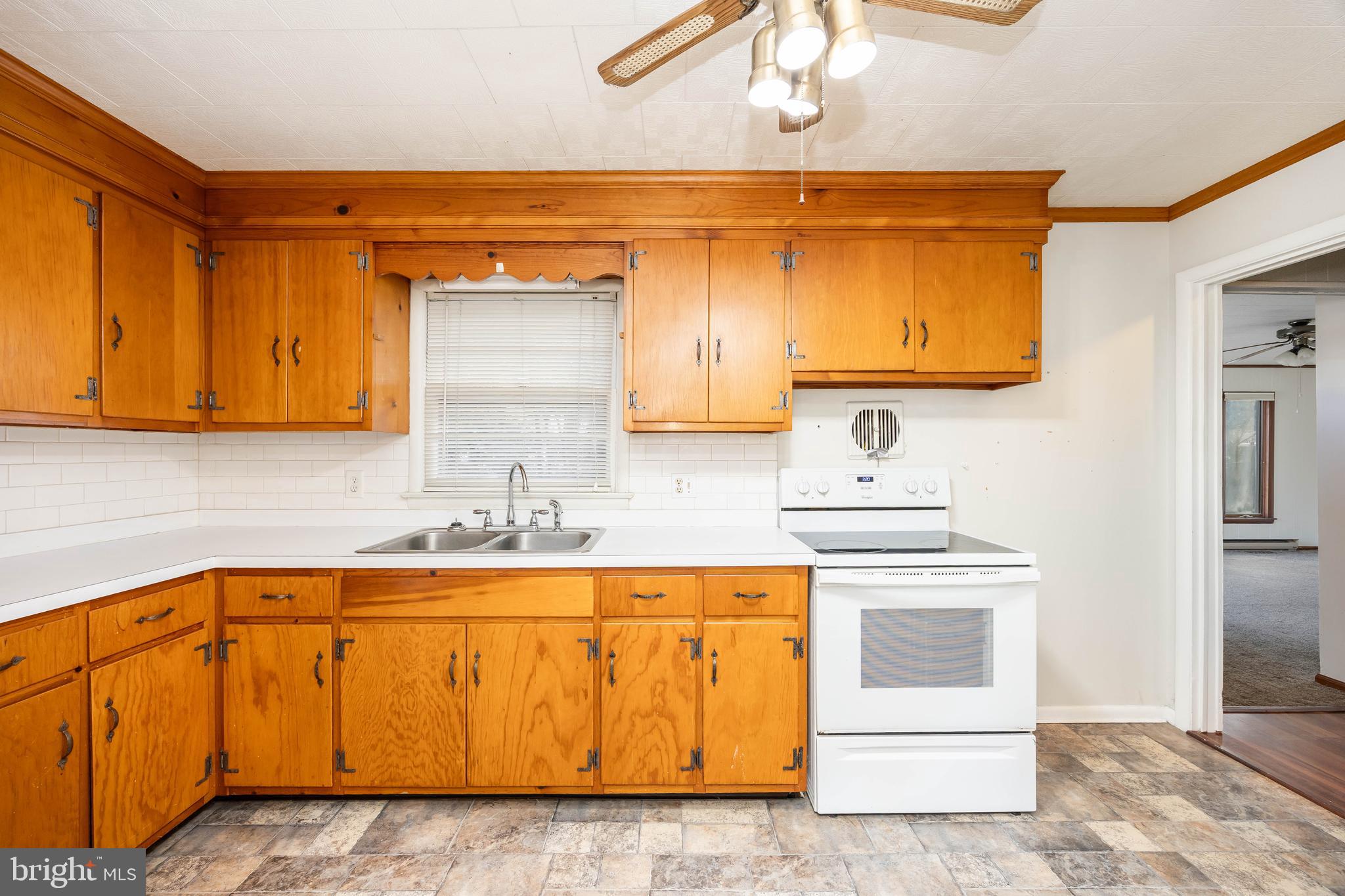 310 Zion Road Salisbury, MD 21804 - Photo 5 of 40 a kitchen with a sink and cabinets
