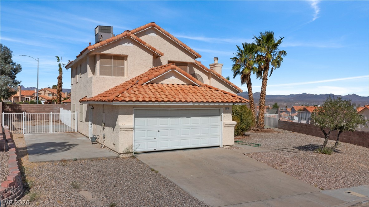 3156 Terrace View Drive Laughlin, NV 89029 - Photo 71 of 94 Discover a desert oasis featuring a tile roof and an attached garage.