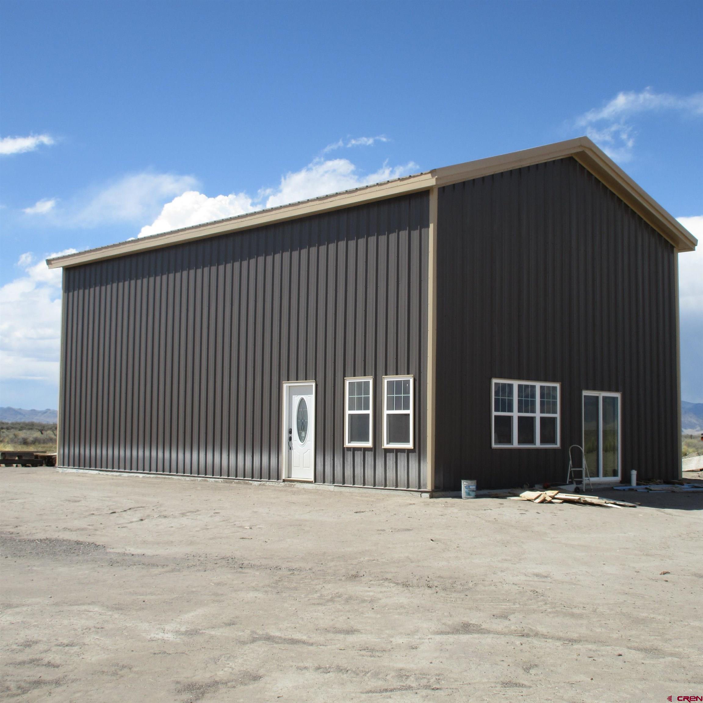 56063 County Road Saguache, CO 81149 - Photo 15 of 21 a view of a house with wooden wall