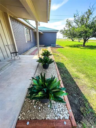 a view of a back yard of the house