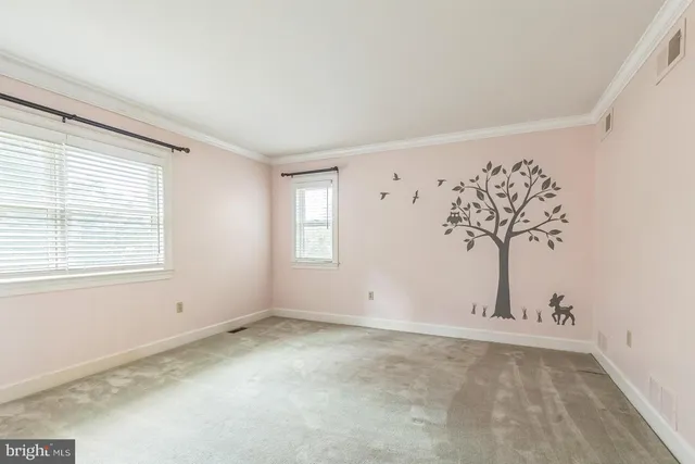 a view of a room with window and ceiling fan