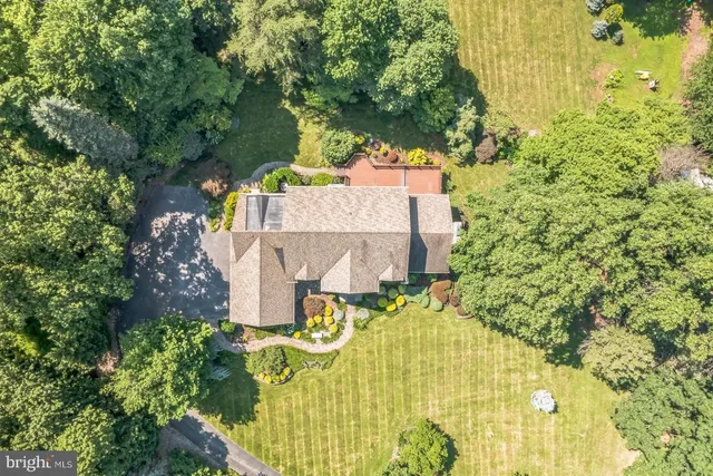an aerial view of residential house with an outdoor space
