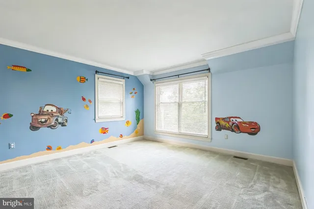 an empty room with toys and wooden floor