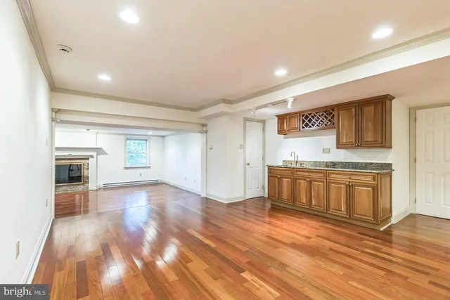 a view of a kitchen with a sink and a stove top oven
