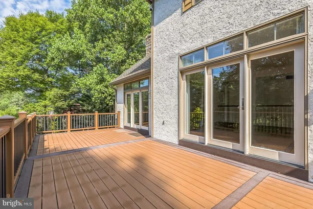 a view of a house with backyard and wooden floor