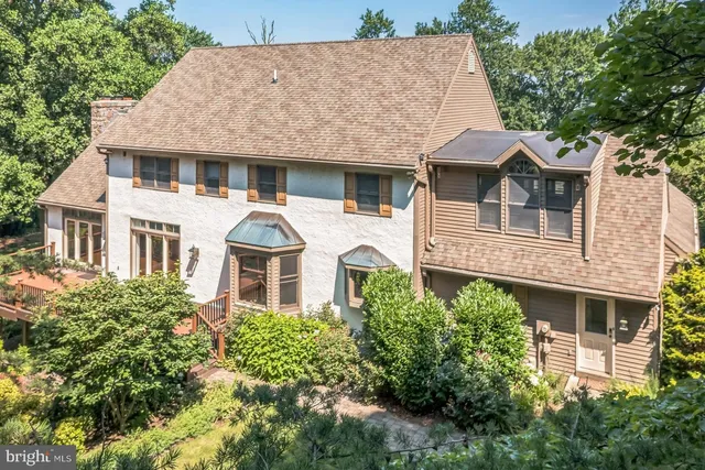 front view of a house with a garden