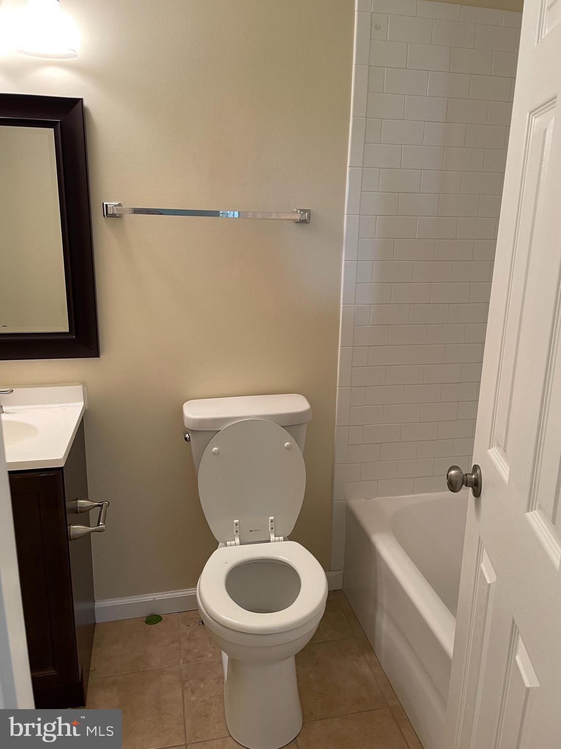 12405 Gooderham Way Gaithersburg, MD 20878 - Photo 21 of 31 a white toilet sitting next to a bathroom sink